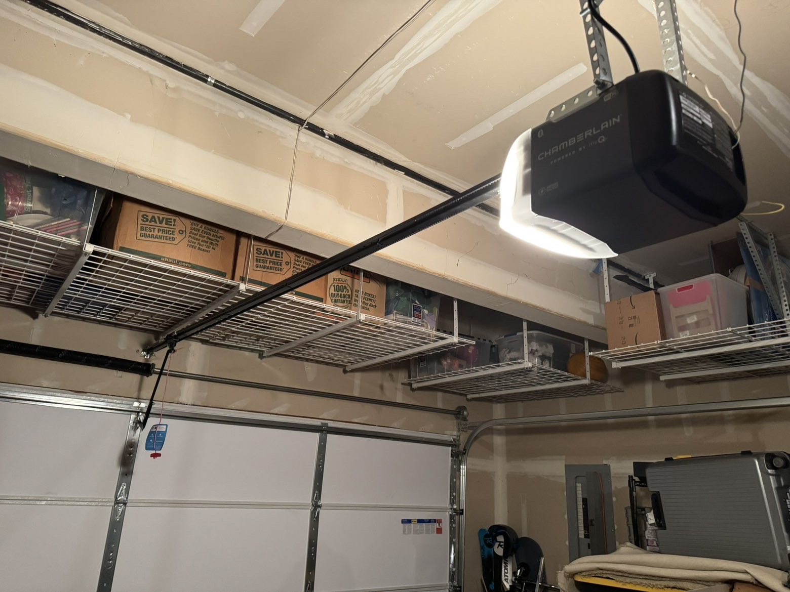 Modern smart garage door opener mounted on ceiling