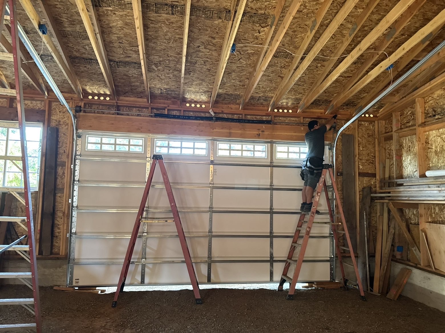 Finished cedar wood garage door installation
